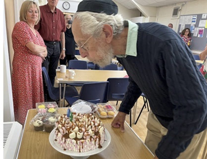 Harvey blowing out birthday cake candles