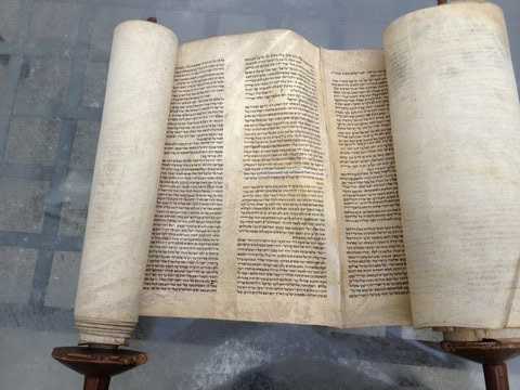 Overall look of the Sefer Torah with the broken Etz Chaim/rollers